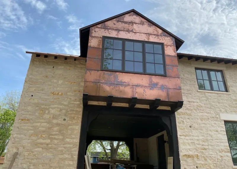 Copper metal panel facade on a stone building for Metal Roof Coating in Menifee